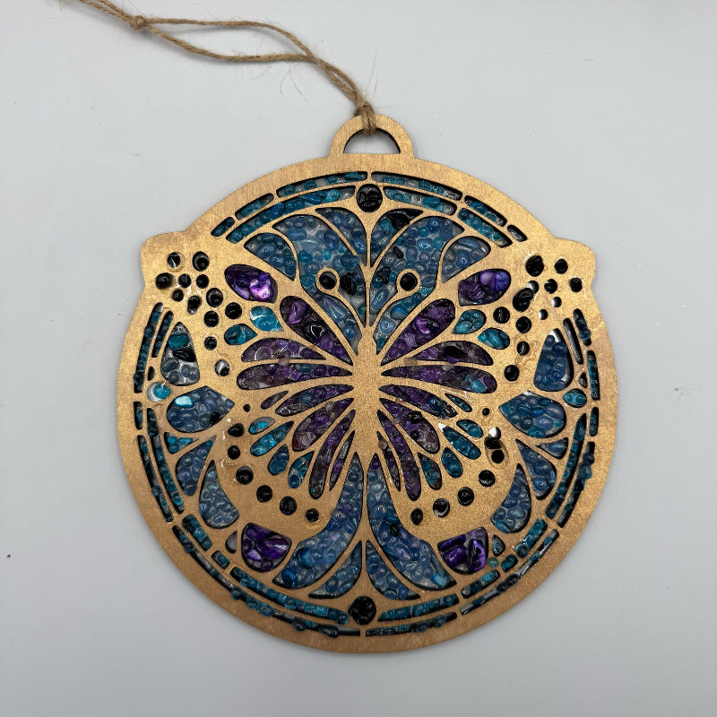 Decorative ornament with intricate design on a plain background