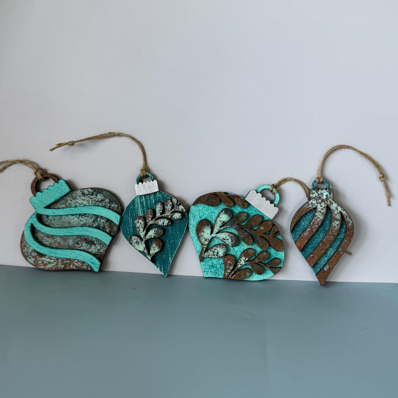 Set of decorative ornaments with turquoise and brown patterns on a white and gray background