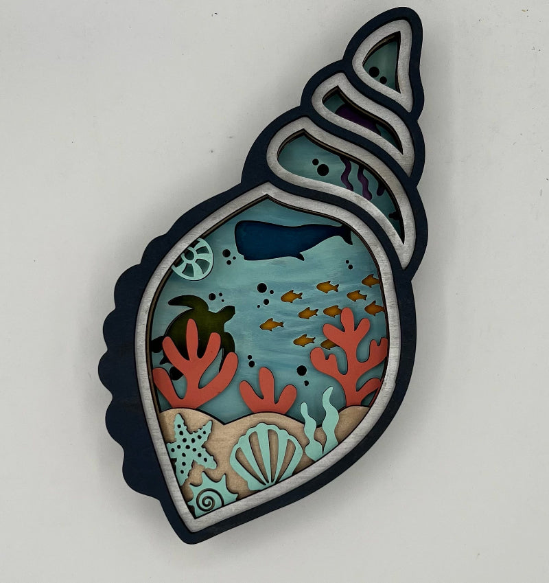 Decorative wall art with underwater scene inside a shell