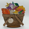 Decorative basket with seashells and starfish on a white background