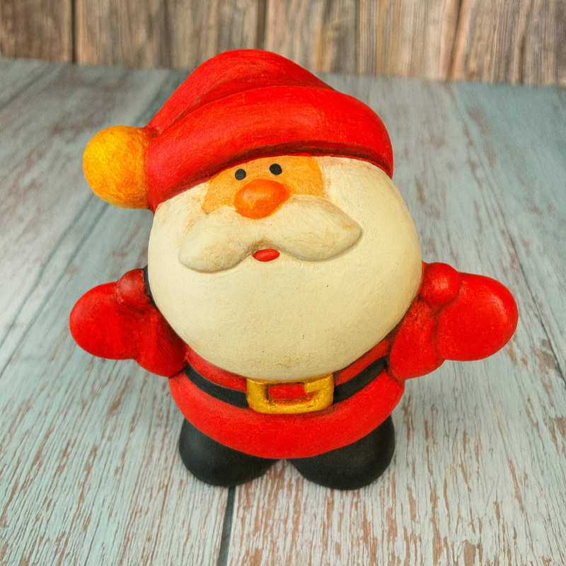 Santa Claus figurine on a wooden surface