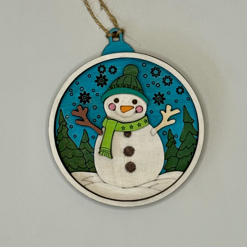 Decorative ornament with a snowman design on a plain background