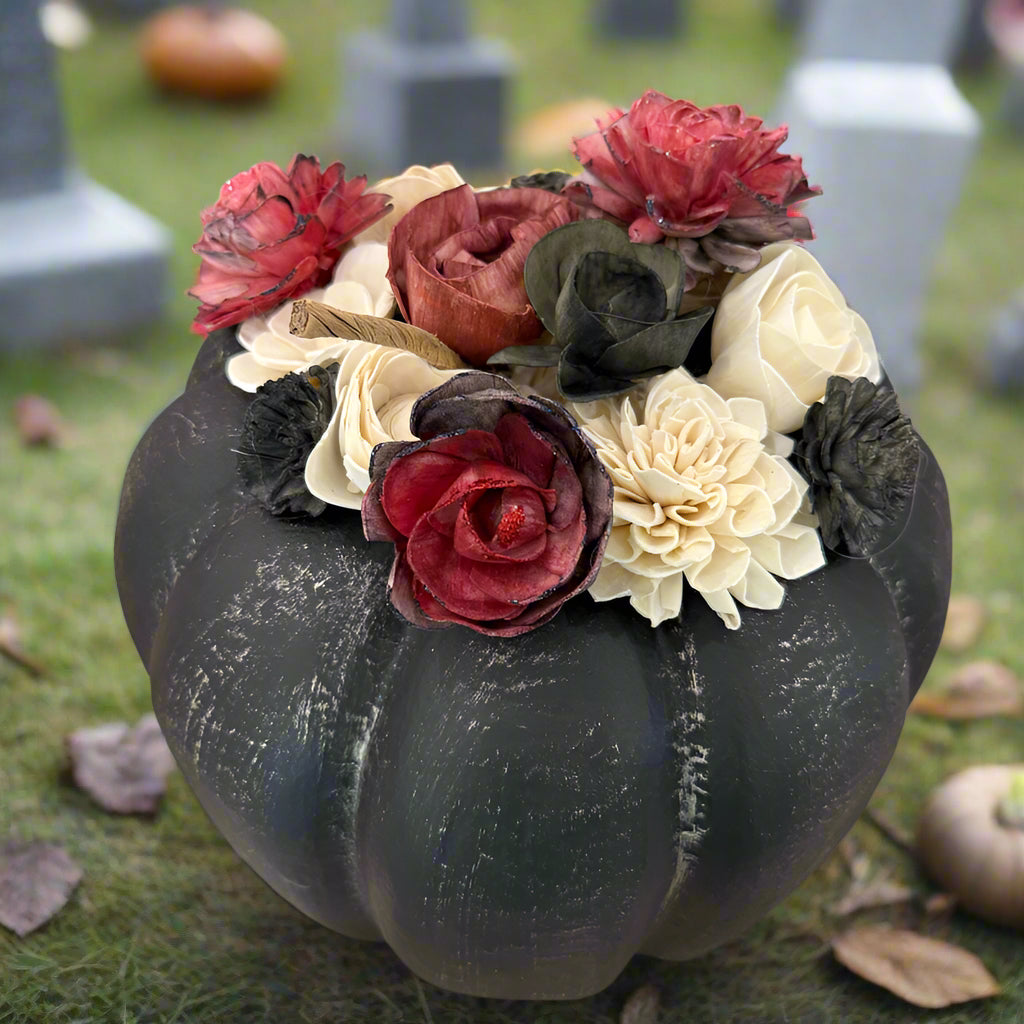 Decorative pumpkin with flowers on a table