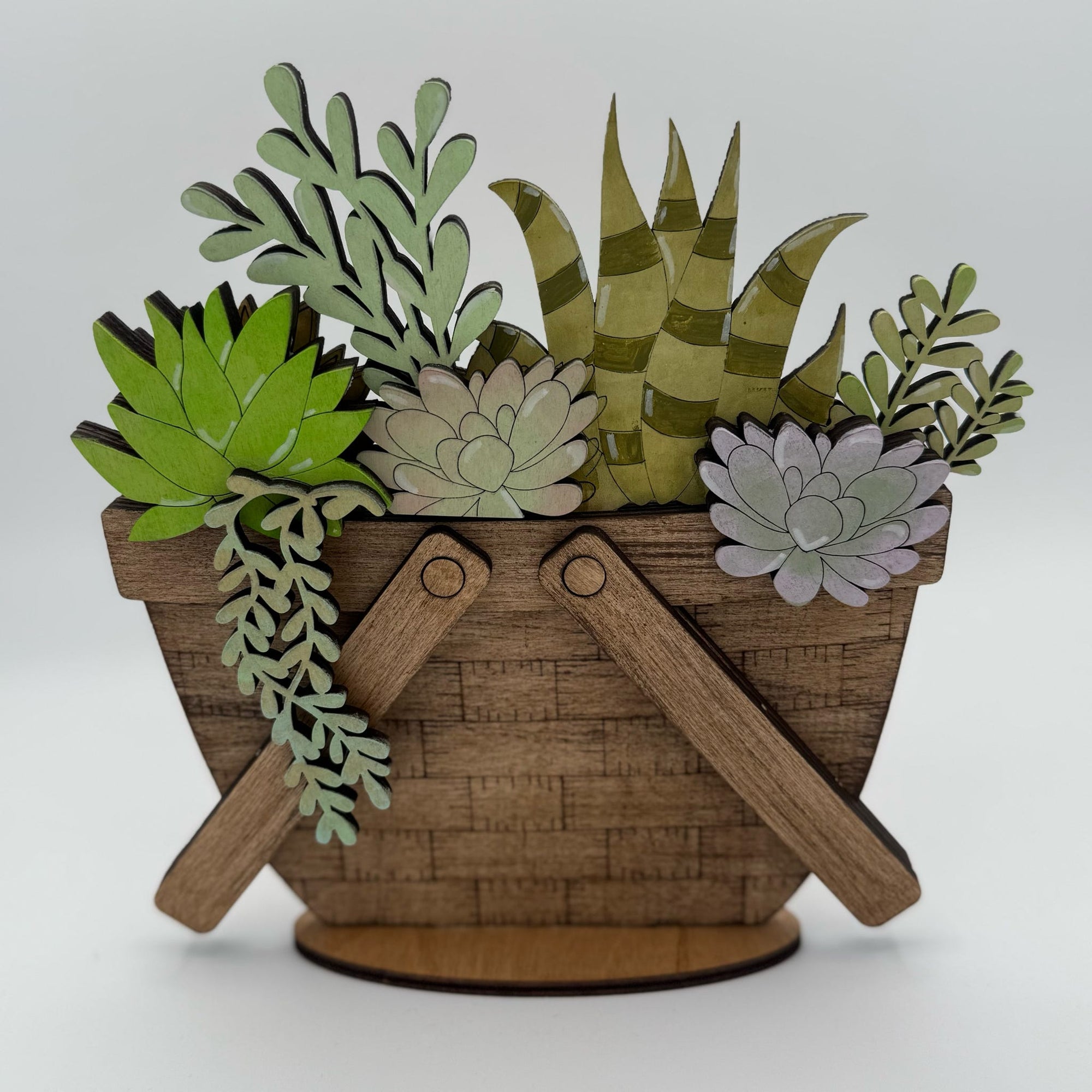 Decorative basket with paper plants on a white background