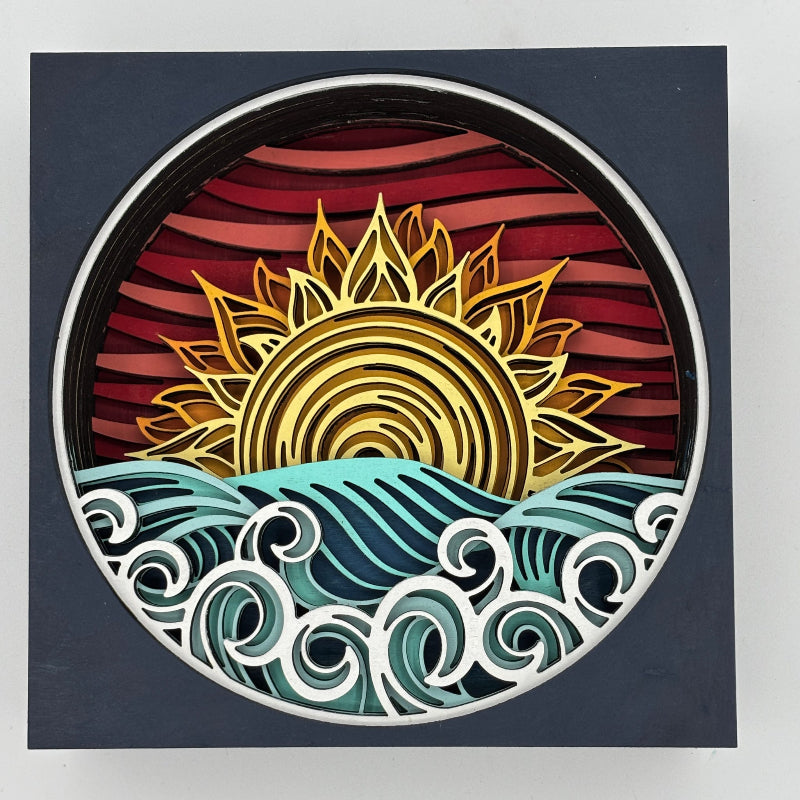 Decorative wall art with a sun and wave design on a dark background
