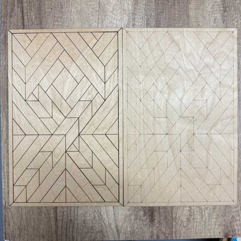 Two wooden panels with geometric pattern on a wooden surface