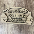 Wooden sign with 'Sweethearts Coffee Bar' text on a wooden surface