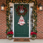 Person holding a Christmas-themed sign in front of a store entrance