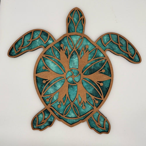 Decorative turtle wall art with teal and brown colors on a white background