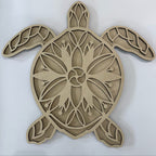 Wooden turtle decorative item with intricate carvings on a white background
