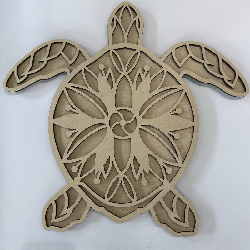 Wooden turtle decorative item with intricate carvings on a white background