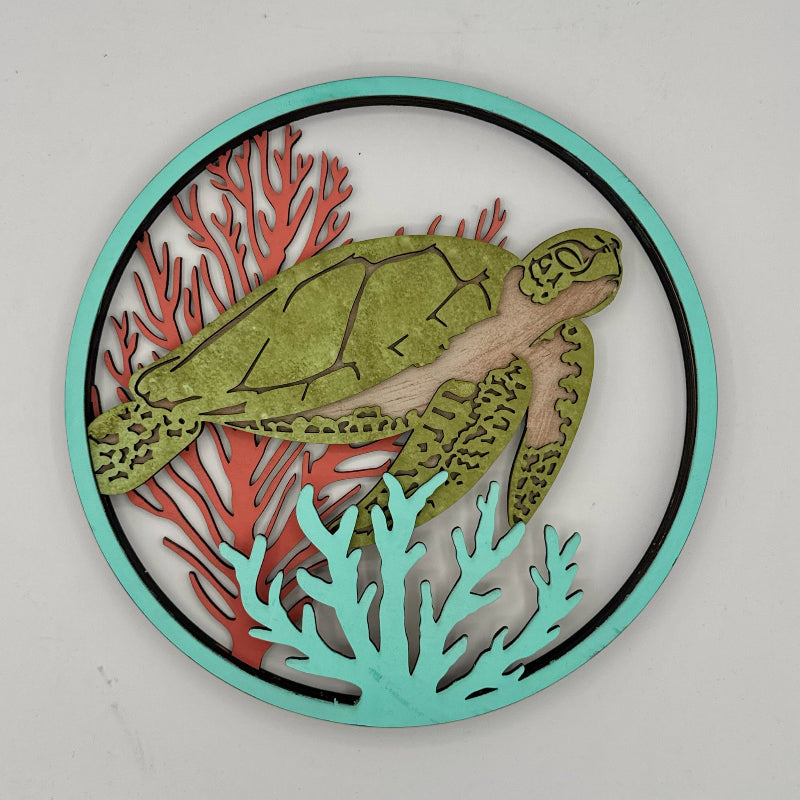 Decorative wall art with a turtle and coral design on a white background