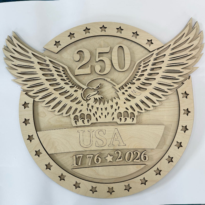Wooden plaque with an eagle design and '250 USA 1776-2026' text on a white background