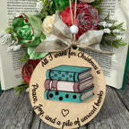 Decorative ornament with books and flowers on a wooden surface