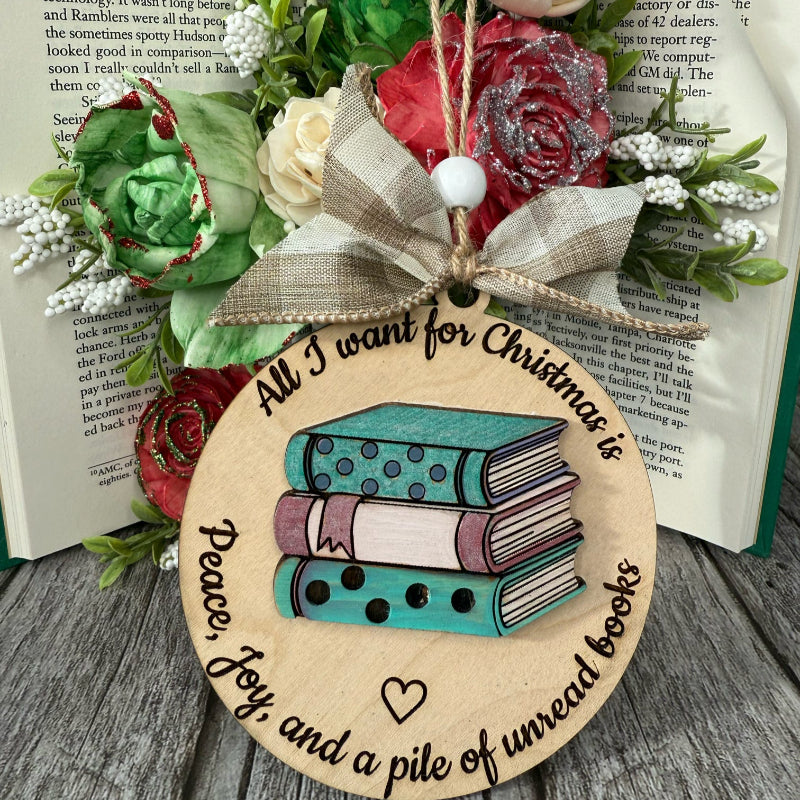 Decorative ornament with books and flowers on a wooden surface