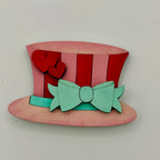 Colorful top hat with red and pink stripes and a green bow on a white background