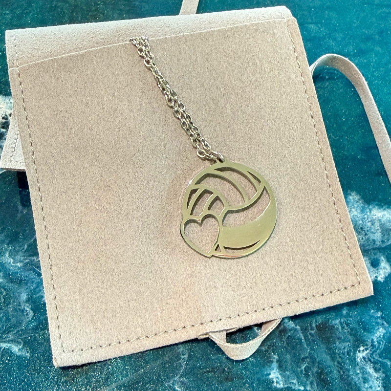 Necklace with a circular pendant on a beige card against a blue textured background