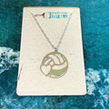 Necklace with a heart and wave design on a card with 'Paisley Grace Makery' branding, against a blue water background.