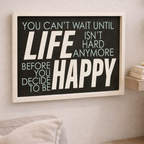 Framed motivational quote on a wall with decor elements below
