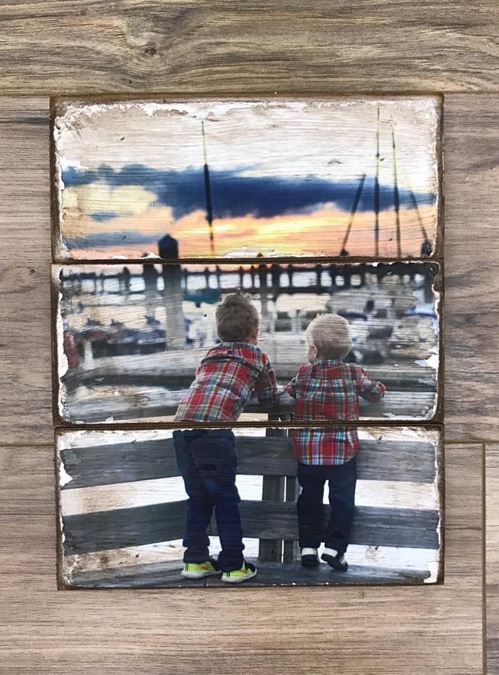Two little boys at a marina at sunset photo on a three plank wood photo block