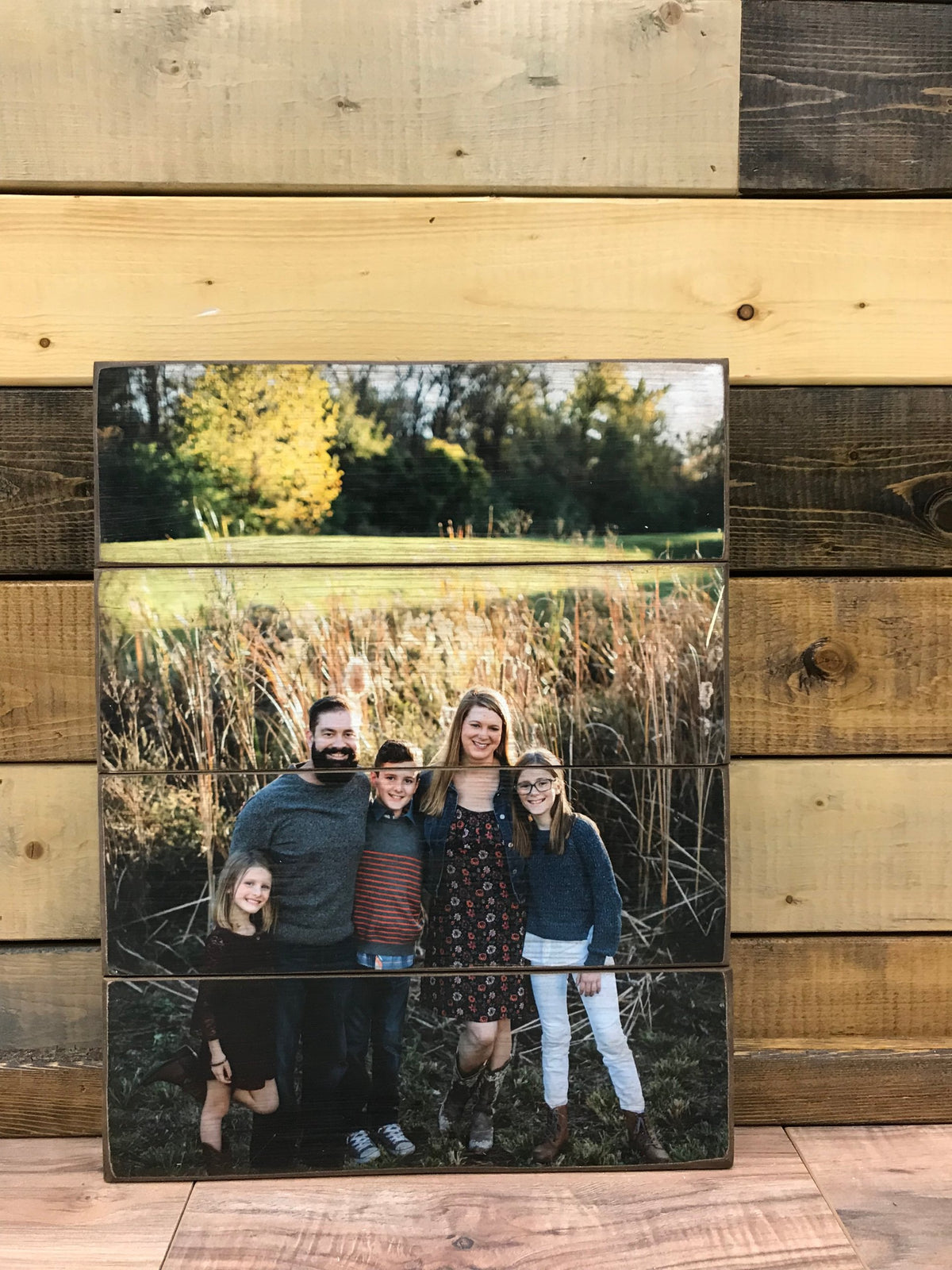 Family of five photo in tall autumn grass on a four plank custom wood photo pallet