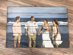 Beach wedding family photo on a six plank wood photo pallet
