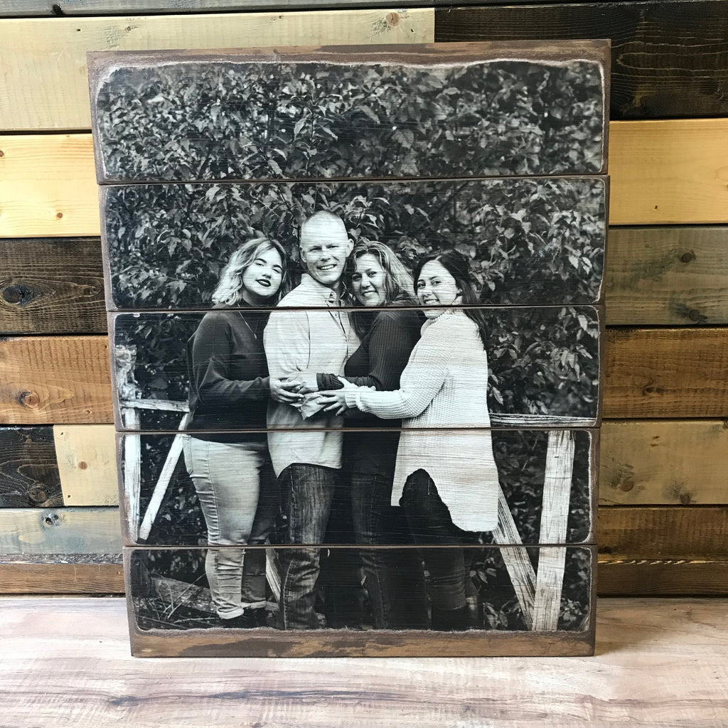 Black and white family of four photo transferred onto a five plank wood photo pallet