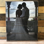 Silhouette wedding photo of a bride and groom on a five plank wood photo pallet