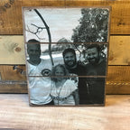 Black and white family of four beach photo on a three plank wood photo block