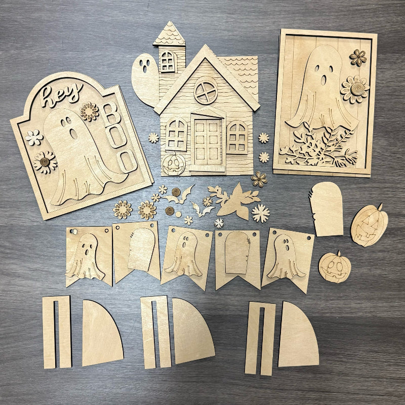 Wooden Halloween-themed cutouts on a wooden surface